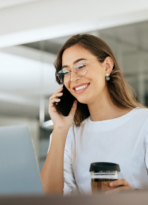 Smiling woman talking on phone