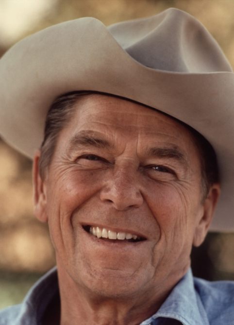 Ronald Reagan smiling in a cowboy hat