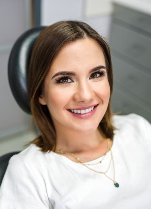 Smiling woman sitting in dental chair