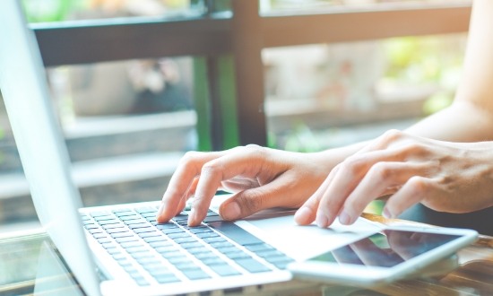 Person typing on a laptop