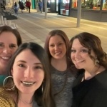 Selfie of dental team on city sidewalk