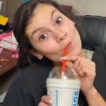 Dental team member taking a sip of a milkshake