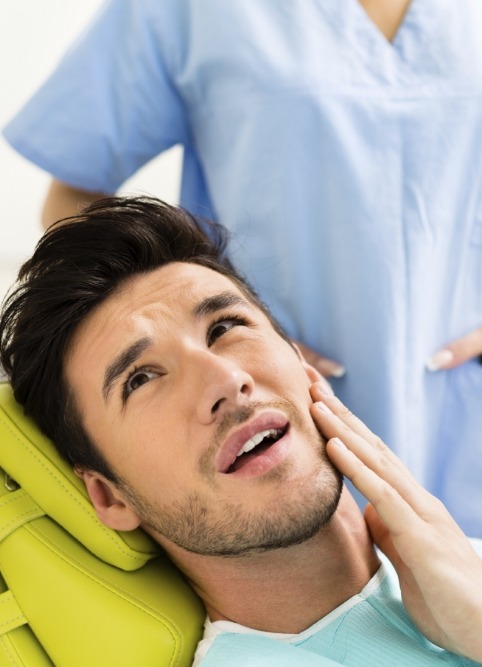 Man holding his jaw in pain before T M J treatment in Stephenville and Eastland